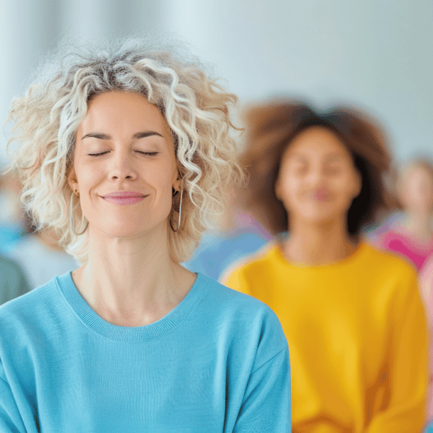 Group of women reducing their stress through mediation and mindfulness practices.