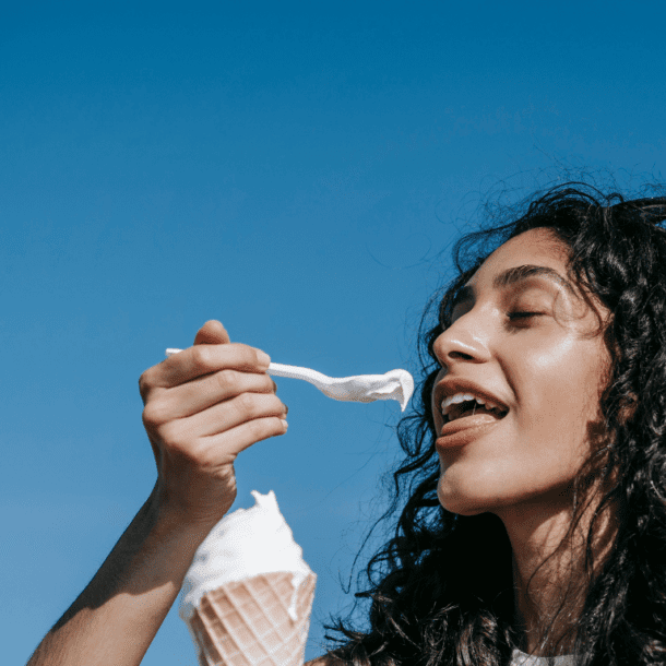 After a stressful day, woman is emotionally eating some ice cream.