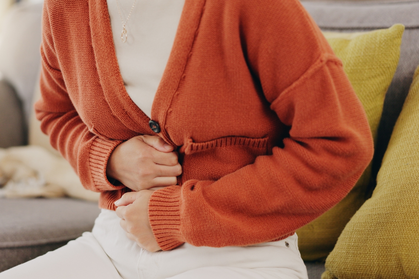 Woman feeling nauseous after taking Ozempic weight loss medication.