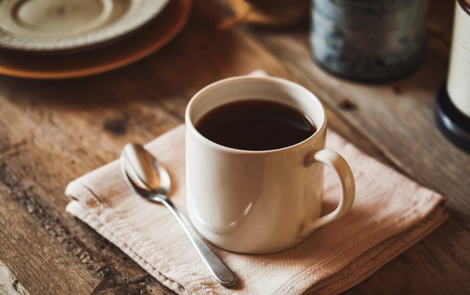 Black coffee on a table. Does coffee break a fast?