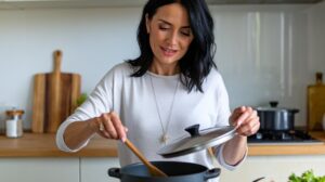 Woman in her kitchen making a quick healthy dinner on a busy weeknight.