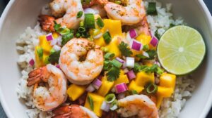 A bowl of Zesty Shrimp and Mango Salsa Rice Bowls